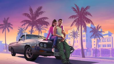 GTA VI key art featuring the two main protagonists sitting on the hood of a car in an embrace.